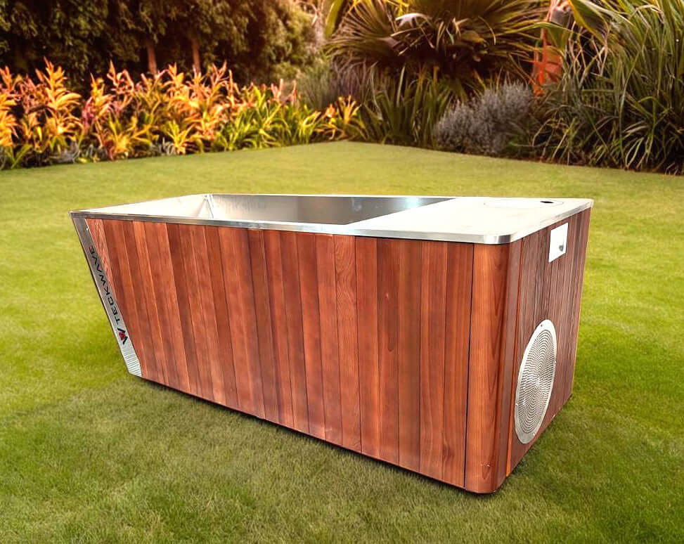 Integrated All in One Prestige Ice Bath with Chiller in a garden setting, showcasing its wooden design and sleek metal accents.