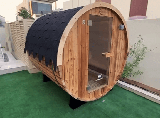 ThermoElite Barrel Sauna in the garden of a villa