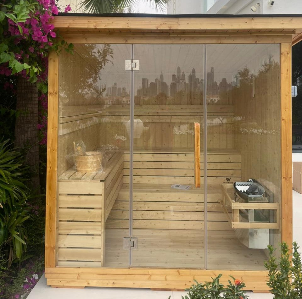 Front view of a TECKWAVE ThermoElite Vista Sauna installed in a garden