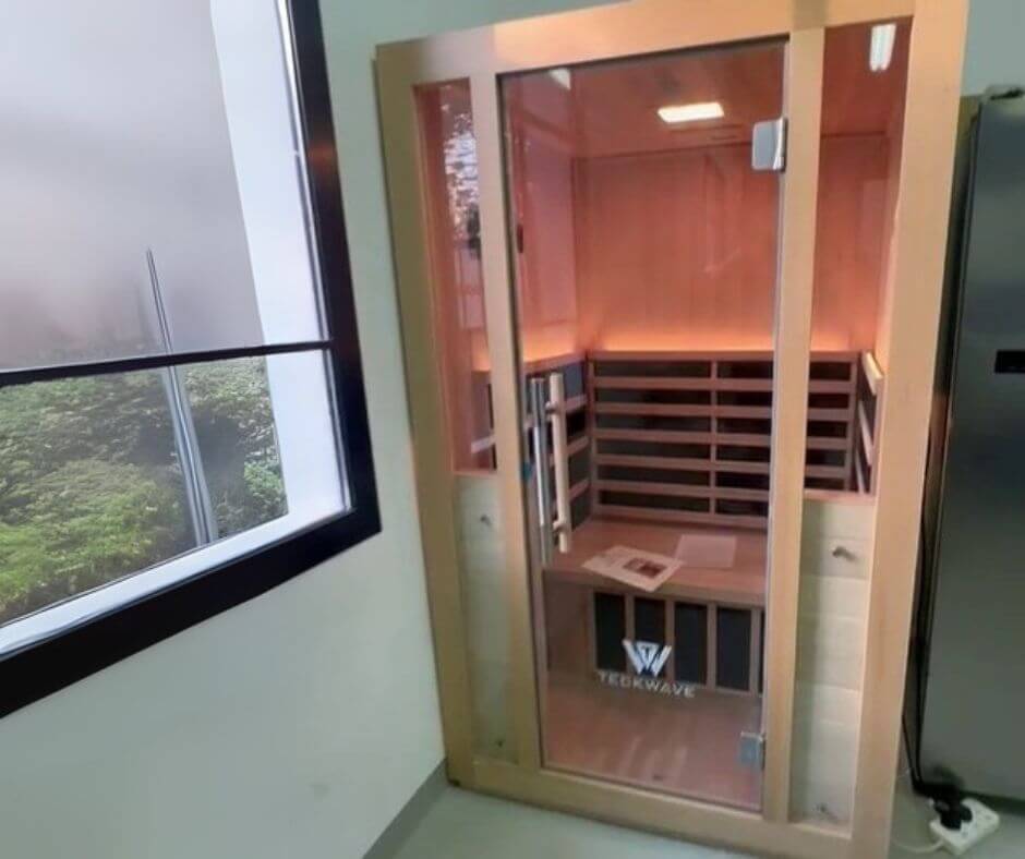 TECKWAVE UrbanGlow Infrared Sauna next to a fridge
